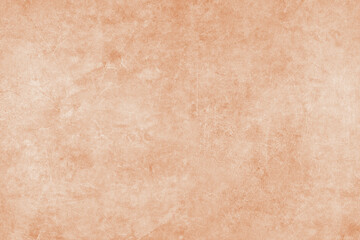 Painted orange grungy concrete background texture. Abstract wallpaper, shabby stone wall, vintage stucco surface, studio backdrop