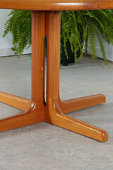 Mid-century modern wooden rounded corner table. Product photograph of vintage dining room furniture.