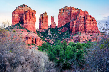 Cathedral Rock lights up at dusk from Crescent Moon Park in Sedona Arizona