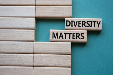 Diversity matters symbol. Wooden blocks with words Diversity matters. Beautiful grey green background. Business and Diversity matters concept. Copy space.