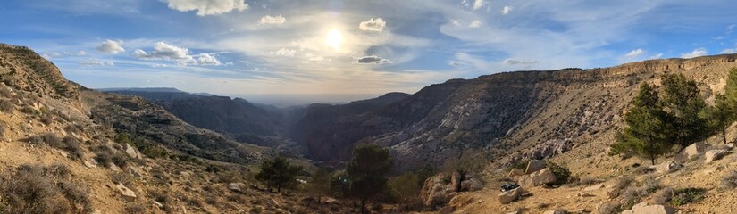 Panorama landscape view of  Wadi Dana a large natural canyon,  Wadi Araba. Dana Biosphere Reserve Dana village near the city of Tafilah,Feynan area in central-western Jordan.Dana valley ecotourism