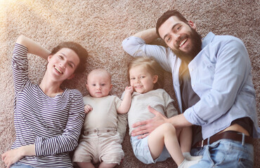 happy family mother father and kids at home