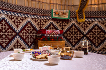 Cozy Yurt Interior with Traditional Meal Table Setup and Colorful Decor