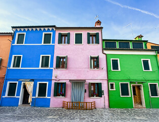 Fototapeta na wymiar Colorful houses facades in famous island near Venice, Burano, Italy