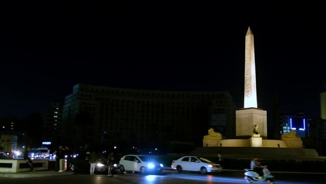 Cars driving on Tahrir Square in Cairo, Egypt. Traffic in night Cairo