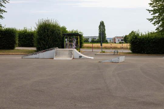 Skate park with different halfpipes in summer