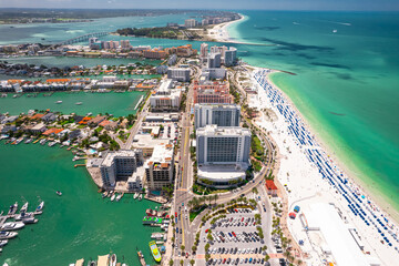 Clearwater Beach Florida. Florida beaches. Panorama of city. Spring or summer vacations. Beautiful view on Hotels and Resorts on Island. Blue color of Ocean water. American Coast. Gulf of Mexico shore