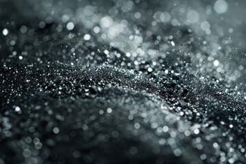 The image is a close up of a black and white photo of a pile of glitter