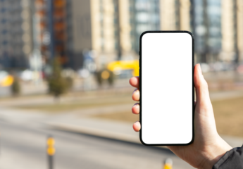 Hand holding mobile phone screen mockup, white blank smartphone display, blurred city background