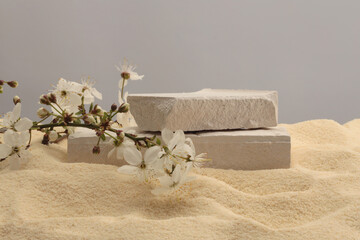 White Stones platform podium on beige sand background. Minimal empty display product presentation...
