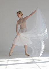 Young beautiful ballerina dancing. Modern Contemporary dance performance. Femininity , Grace and Tenderness concept