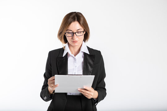 Portrait Of Attractive Business Woman In Black Suit Holding Tablet And Pen Isolated On White Background