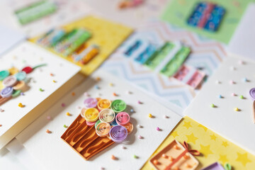 quilling cards with Paper cupcakes. Delicious Cupcakes for party, birthday. making greeting cards. Paper quilling. Hand made of paper quilling technique. Handicraft at home. Hobby, home office.