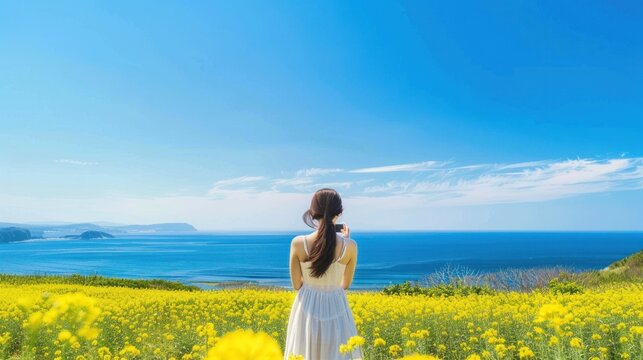 woman in white dress on meadow and blue sky