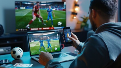 A man is watching sports and betting with his mobile phone