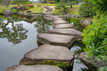 Large flat rocks forming a path over a Japanese pond.
Koko-en zen garden near Himeji castle.
