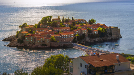 Panoramic view of Sveti Stefan island, Saint Stefan island, with a small hotel town on it, the...