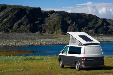 Camper parked on the seashore in Hamningberg on the Varanger Peninsula, Norway - 776369659