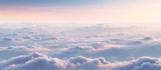 Above, the sky presents a mesmerizing sight with fluffy clouds and a distant moon glowing in the night