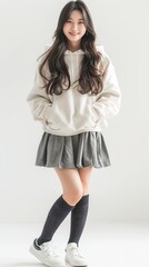 Naklejka premium Portrait of young Asian woman, isolated on white background. Full body.