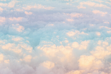 Aerial view of gradient pastel colors of fluffy colorful clouds. Copy space background.