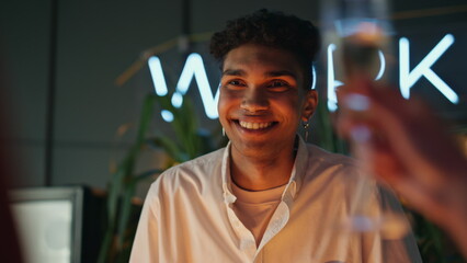 Smiling guy laughing at night bar closeup. African american man feeling happy