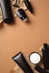 Set on men's cosmetics on brown background. Natural beauty products for men's grooming, skin care.