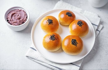 Red bean paste buns with black sesame seeds sprinkles