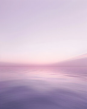 A beautiful, serene ocean scene with a pink sky. The water is calm and the sky is a soft pink color