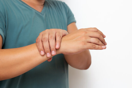 Holding hand man with pain in muscles and joints,Symptoms of peripheral neuropathy and numbness in the fingertip and palm,Diseases caused by side effects of vaccination,Guillain Barre Syndrome(GBS) 