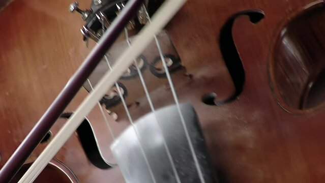 Bow Strokes, A Man Playing a Violin. Close Up. 4K Resolution.