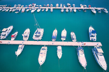 Aerial view of boats and yachts moored to jetty. Yachts in marina
