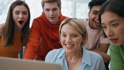 Fototapeta premium Winners team celebrating success at laptop workplace closeup. Group rejoicing