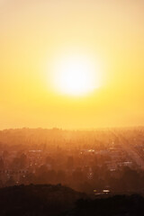 San Fernando Valley sunburst sunrise vertical view.  Photograph taken at Santa Susana Pass State Historic Park in the Chatsworth neighborhood of Los Angeles California.