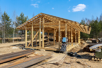 Construction of a house made of laminated veneer lumber. The frame of the house. Cottage made of...
