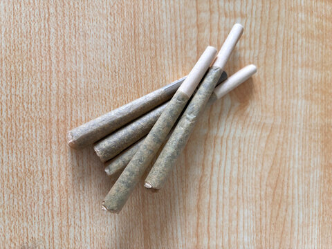 Rolled marijuanna flower joints on top of a table, pre rolls