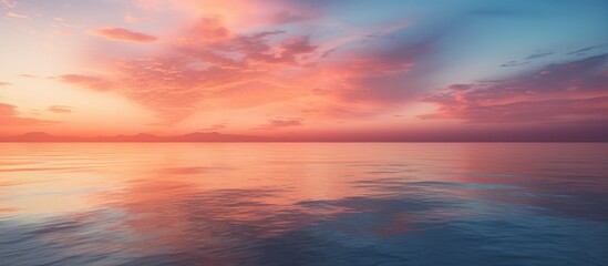 Fototapeta premium A beautiful scene of a boat peacefully sailing in the ocean waters during a stunning sunset