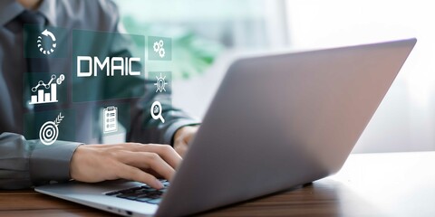 A businessman using laptop on DMAIC concept. Define, Measure, Analyze, Improve and Control.