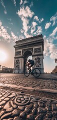 Obraz premium cyclist passing by the Arc de Triomphe