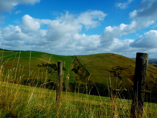 Tranquil Countryside Bliss: Rolling Hills and Rustic Wire Fences in Picturesque Landscape! - 776486275