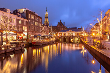 Night Leiden canal Oude Rijn in Christmas illumination, South Holland, Netherlands.