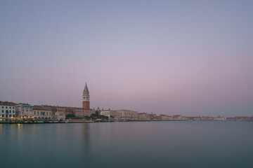 Panoramic view from sea of Piazza San Marco Campanile and Doge Palace on a hazy winter evening, Venice, Veneto, Italy