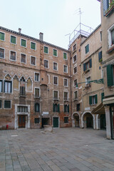 Fototapeta na wymiar Typical cityscape of small town square with surrounding buildings in Venice, Veneto, Italy