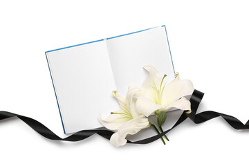 Beautiful lily flowers with blank book and black funeral ribbon on white background