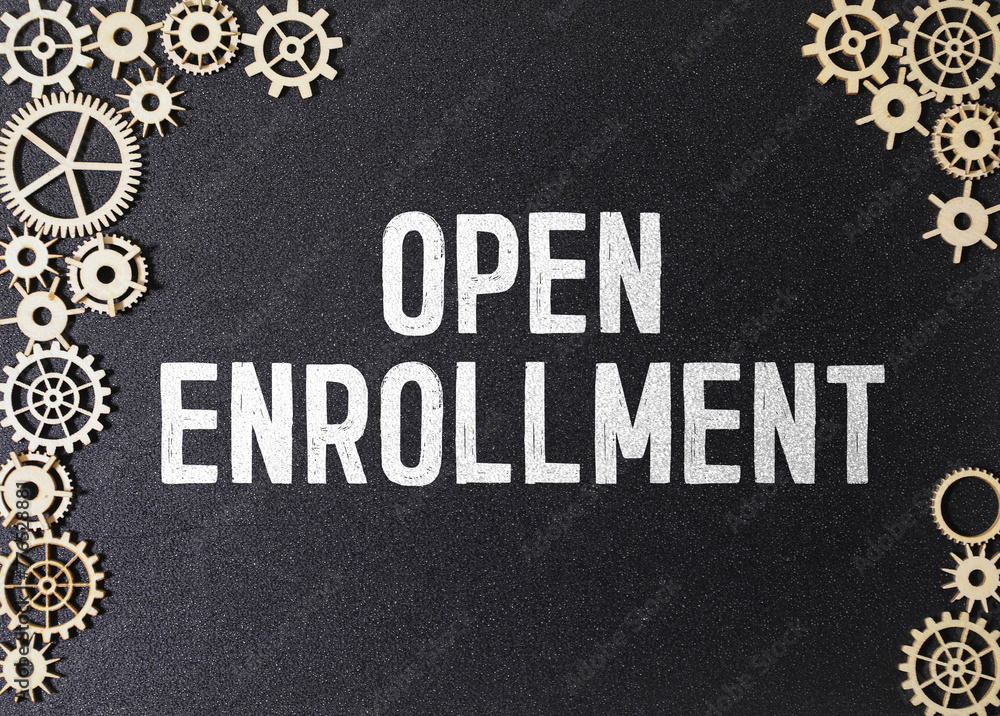 Poster white notepad with the words open enrollment and a stethoscope on a blue background.