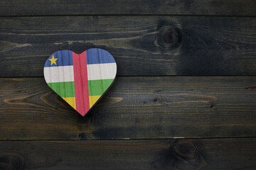 wooden heart with national flag of central african republic on the wooden background.