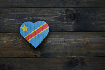 wooden heart with national flag of democratic republic of the congo on the wooden background.