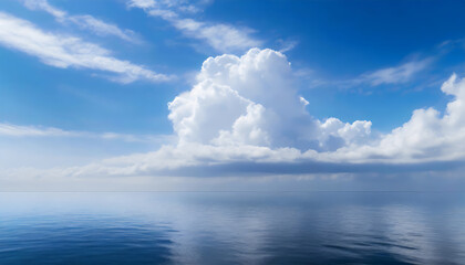 Beautiful blue sky, with fluffy clouds over the calm ocean