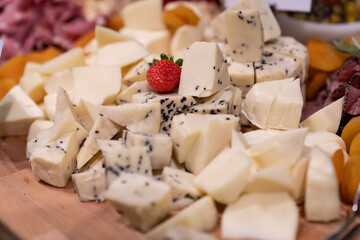 Board with different types of cheese: Dor blu, chedar, Parmesan, brie, honey sauce, finger bread and strawberry. Restaurant menu plate. cheese platter.
Roquefort cheese, mozzarella and parmesan.