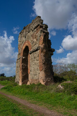 Ruins of the ancient Acqua Claudia aqueduct at Parco degli Acquedotti, Rome, Italy